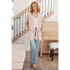 Layer your look with our Surely a Win Sleeveless Cardigan. Crafted from gorgeous beige lightweight sweater knit shawl