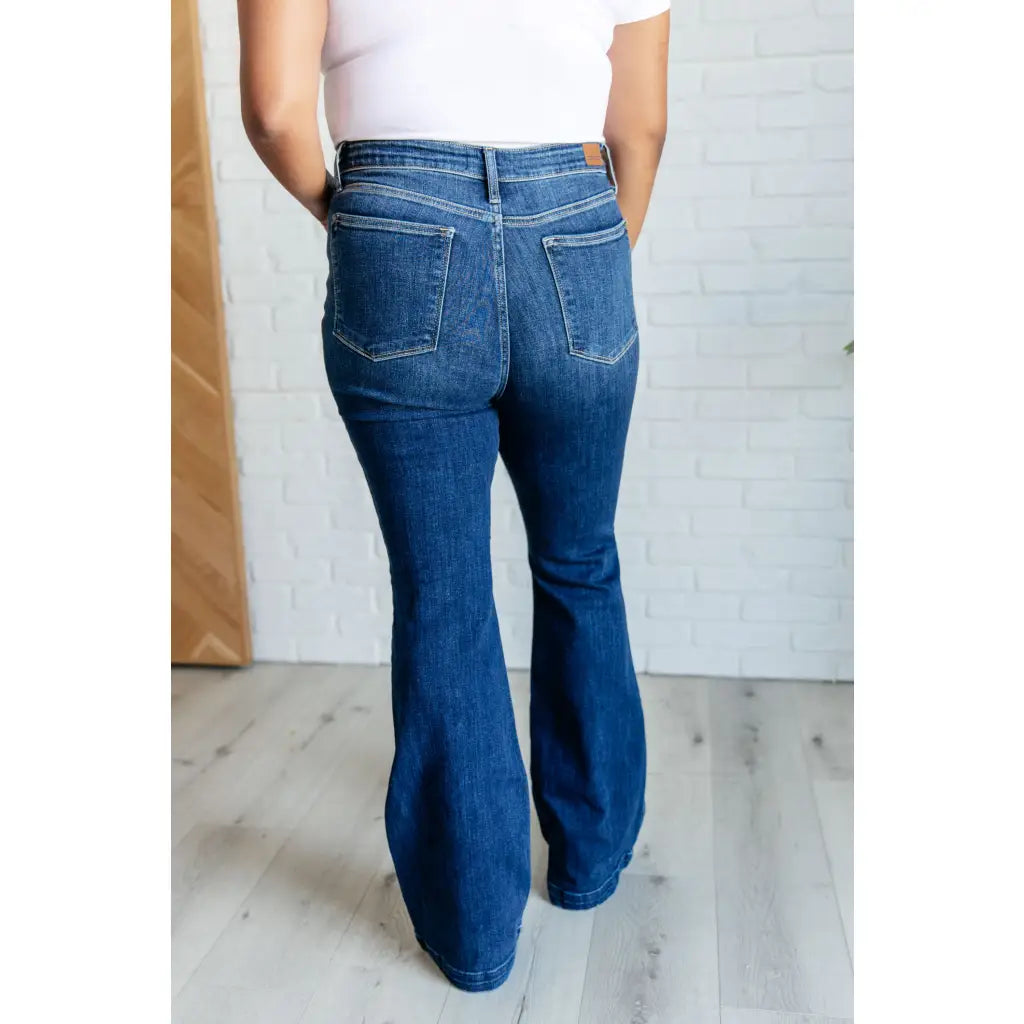 Our Sweet Side Seams Flare Judy Blue Jean are high rise non-distressed jeans feature a dark wash and unique offset side