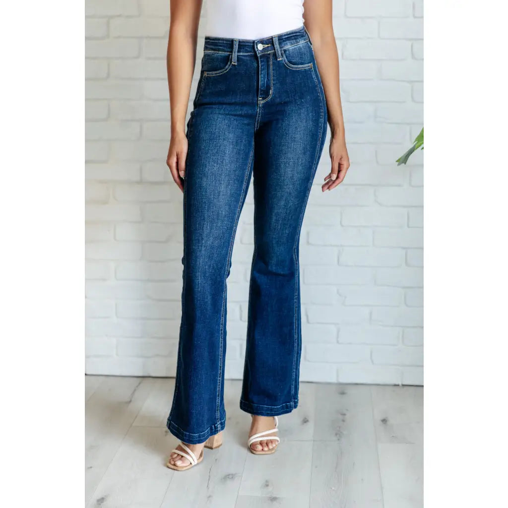 Our Sweet Side Seams Flare Judy Blue Jean are high rise non-distressed jeans feature a dark wash and unique offset side