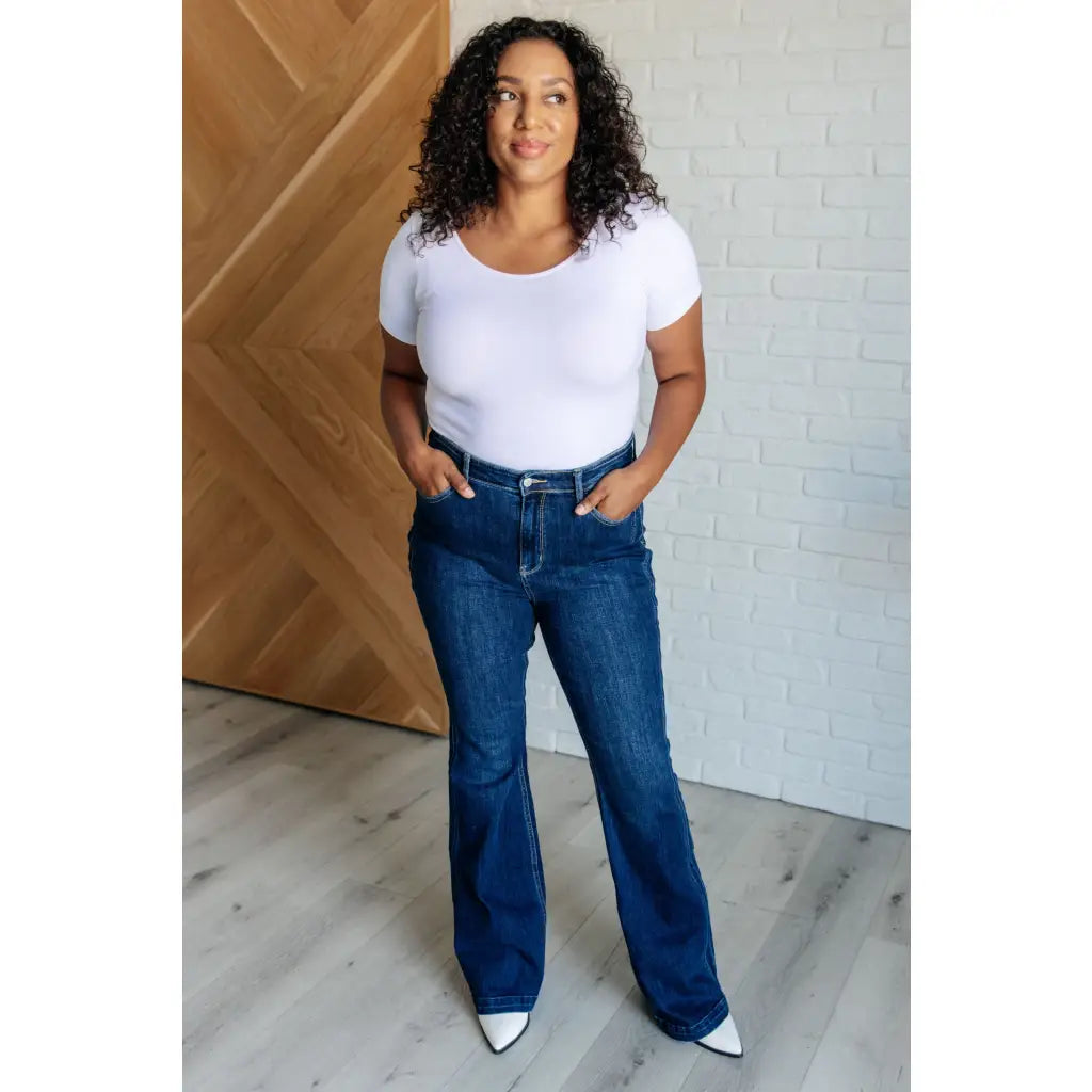 Our Sweet Side Seams Flare Judy Blue Jean are high rise non-distressed jeans feature a dark wash and unique offset side