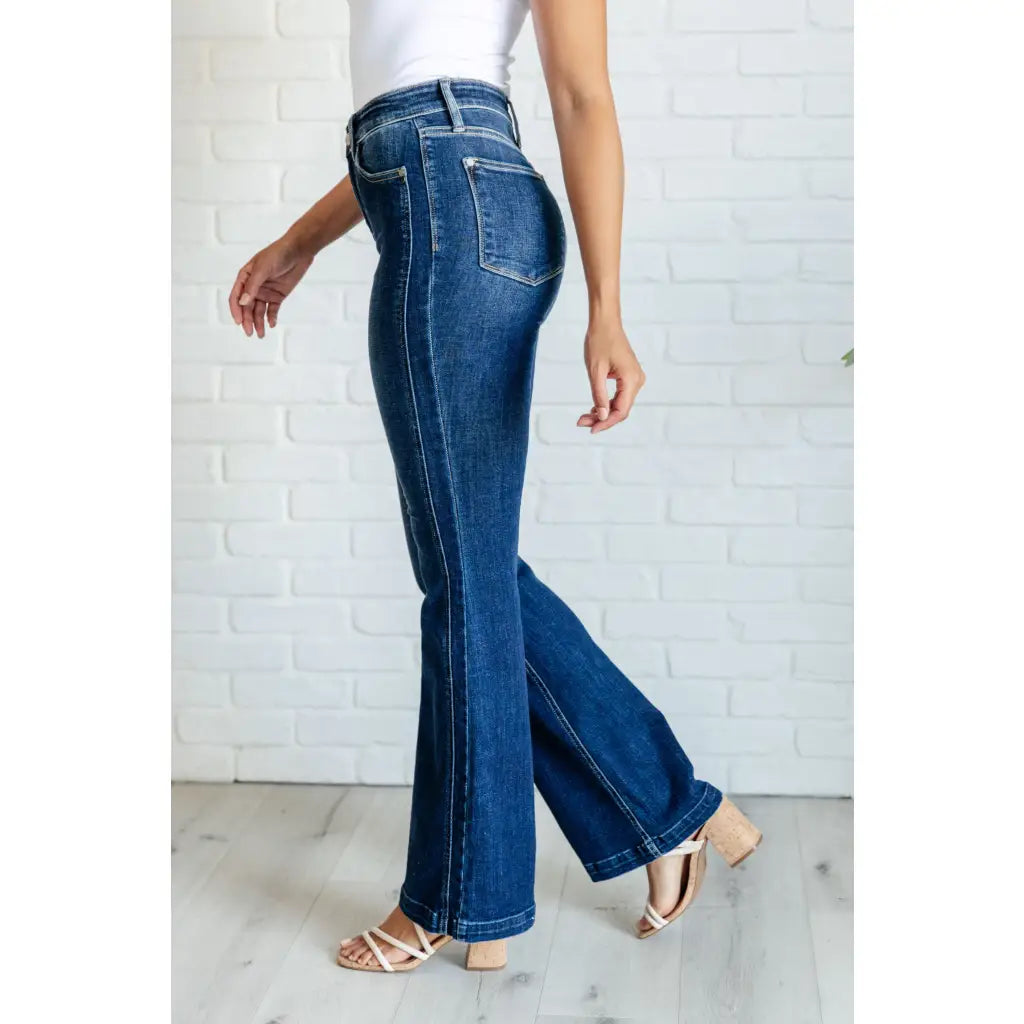 Our Sweet Side Seams Flare Judy Blue Jean are high rise non-distressed jeans feature a dark wash and unique offset side