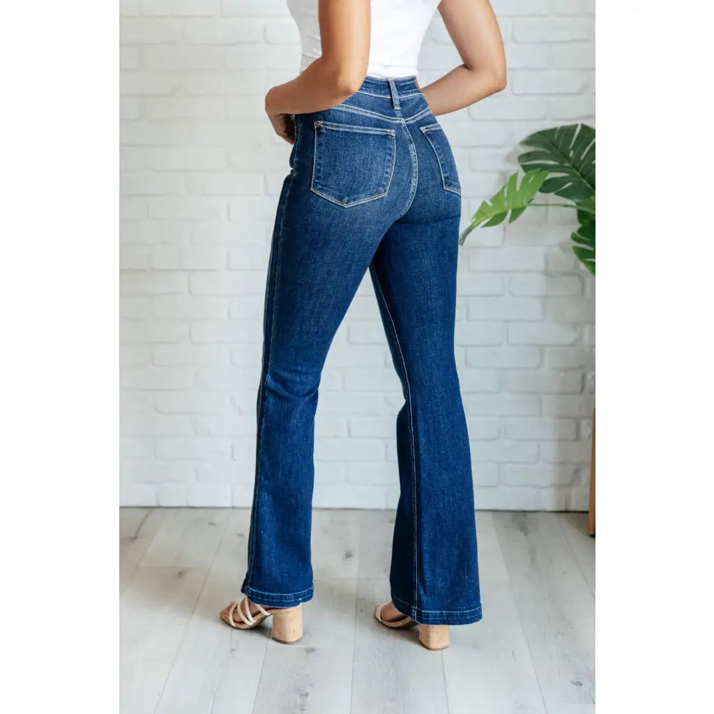 Our Sweet Side Seams Flare Judy Blue Jean are high rise non-distressed jeans feature a dark wash and unique offset side