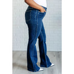 Our Sweet Side Seams Flare Judy Blue Jean are high rise non-distressed jeans feature a dark wash and unique offset side