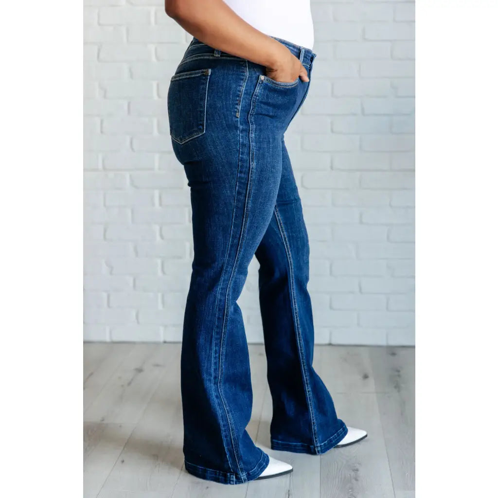 Our Sweet Side Seams Flare Judy Blue Jean are high rise non-distressed jeans feature a dark wash and unique offset side