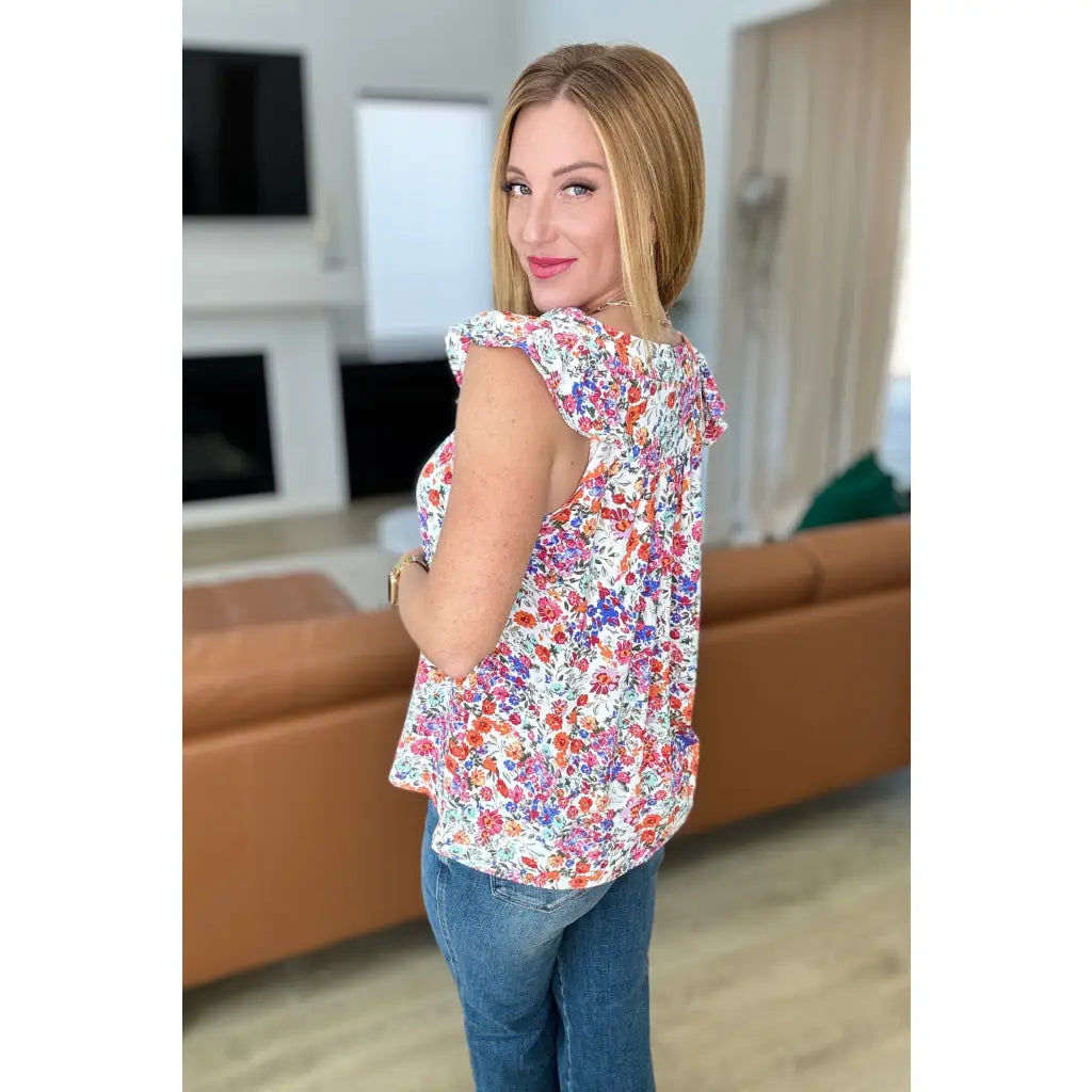 Our Take A Risk Floral Square Neck Top is a lightweight woven top with flutter cap sleeves and perfect for the summer!
