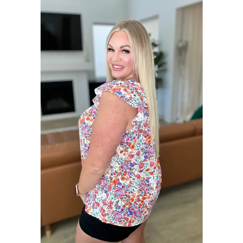 Our Take A Risk Floral Square Neck Top is a lightweight woven top with flutter cap sleeves and perfect for the summer!