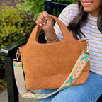Build your perfect tote. Choose brown or black with interchangeable straps for a stylish functional and timeless