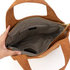 Build your perfect tote. Choose brown or black with interchangeable straps for a stylish functional and timeless