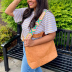 Build your perfect tote. Choose brown or black with interchangeable straps for a stylish functional and timeless