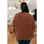 Vintage-inspired plus size friendly cardigan in a vintage brown with cozy knit elbow patches and front pockets. Perfect