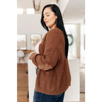 Vintage-inspired plus size friendly cardigan in a vintage brown with cozy knit elbow patches and front pockets. Perfect