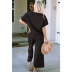 Our Textured Bae Short Sleeve Top and Pants Set is anything but basic. Featuring a drawstring wide leg cropped pant