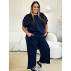 Our Textured Bae Short Sleeve Top and Pants Set is anything but basic. Featuring a drawstring wide leg cropped pant