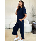 Our Textured Bae Short Sleeve Top and Pants Set is anything but basic. Featuring a drawstring wide leg cropped pant