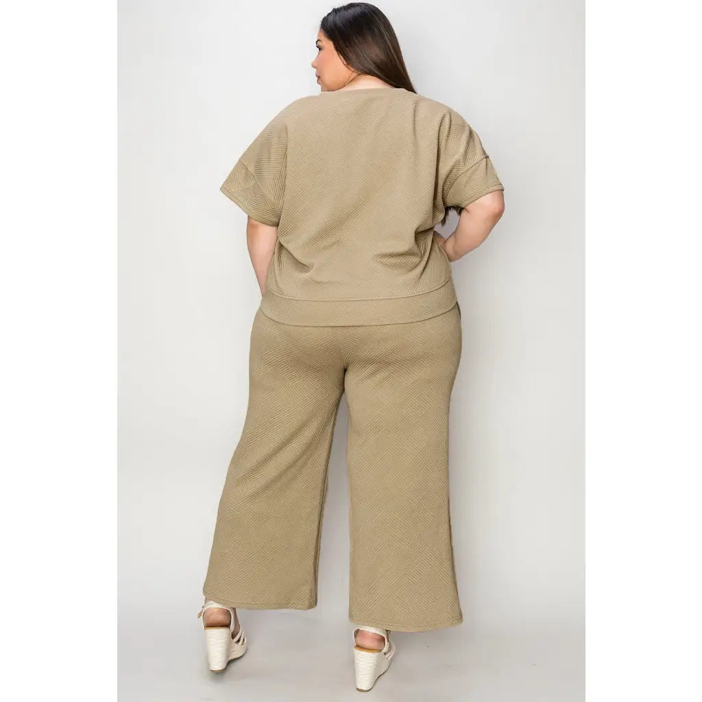 Our Textured Bae Short Sleeve Top and Pants Set is anything but basic. Featuring a drawstring wide leg cropped pant