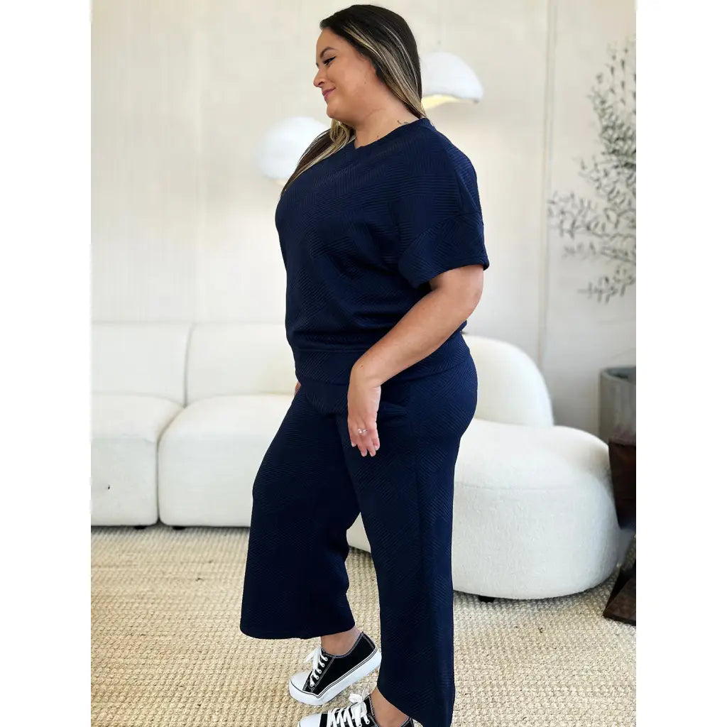 Our Textured Bae Short Sleeve Top and Pants Set is anything but basic. Featuring a drawstring wide leg cropped pant
