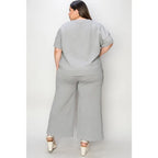 Our Textured Bae Short Sleeve Top and Pants Set is anything but basic. Featuring a drawstring wide leg cropped pant