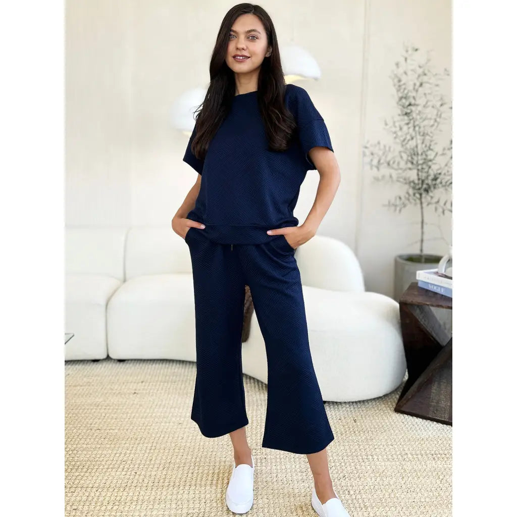 Our Textured Bae Short Sleeve Top and Pants Set is anything but basic. Featuring a drawstring wide leg cropped pant