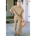 Our Textured Bae Short Sleeve Top and Pants Set is anything but basic. Featuring a drawstring wide leg cropped pant