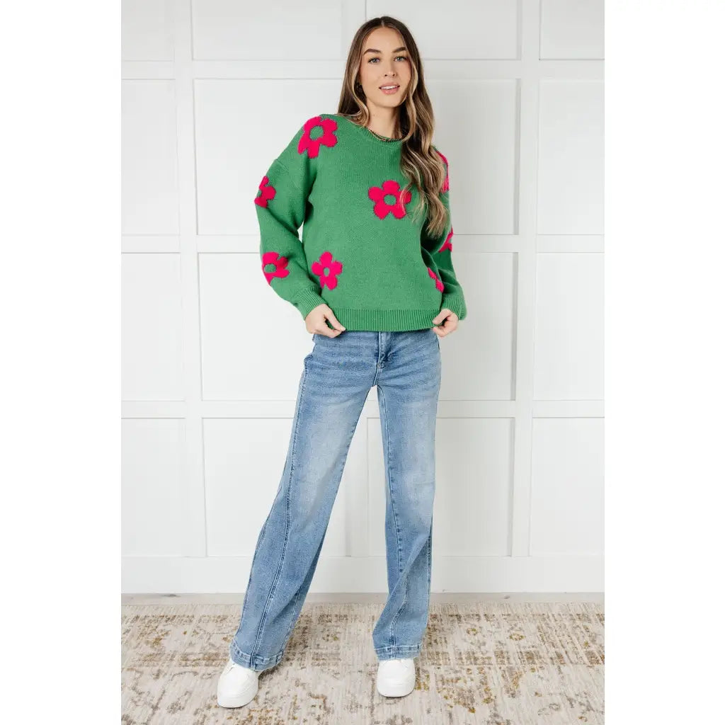 Stay cozy in The Bloom Sweater! A soft ribbed knit pullover with tufted pink flowers balloon sleeves and a relaxed fit.