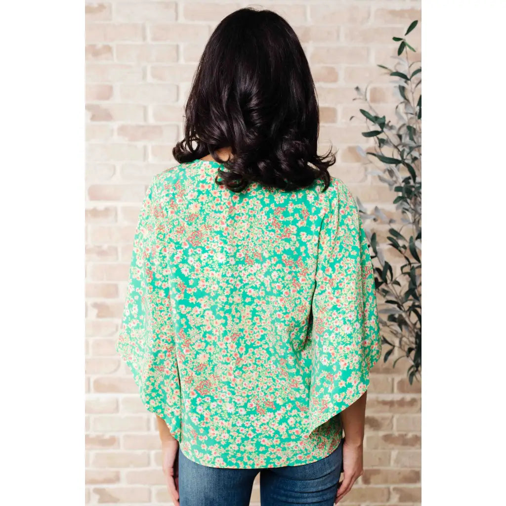 Get ready to embrace the future with our The Future’s Wide Open V-Neck Top! Made soft woven fabric this playful