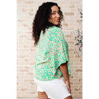 Get ready to embrace the future with our The Future’s Wide Open V-Neck Top! Made soft woven fabric this playful