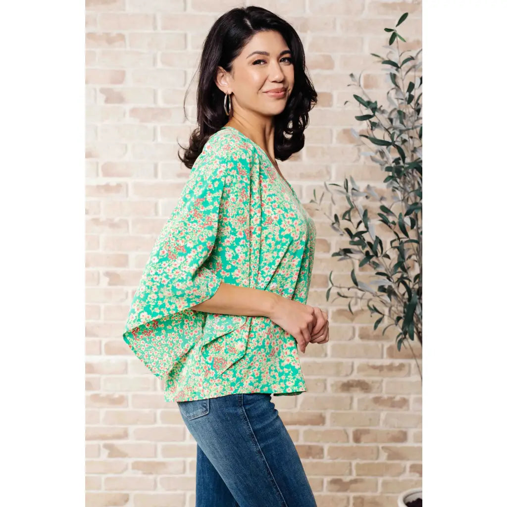 Get ready to embrace the future with our The Future’s Wide Open V-Neck Top! Made soft woven fabric this playful