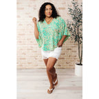 Get ready to embrace the future with our The Future’s Wide Open V-Neck Top! Made soft woven fabric this playful