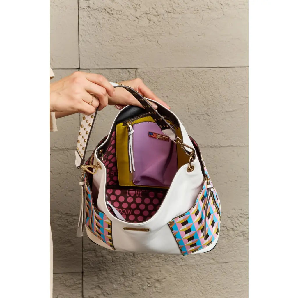 This fantastically fun handbag three piece set includes a Large Shoulder Bag Solid Crossbody and charming Heart Coin