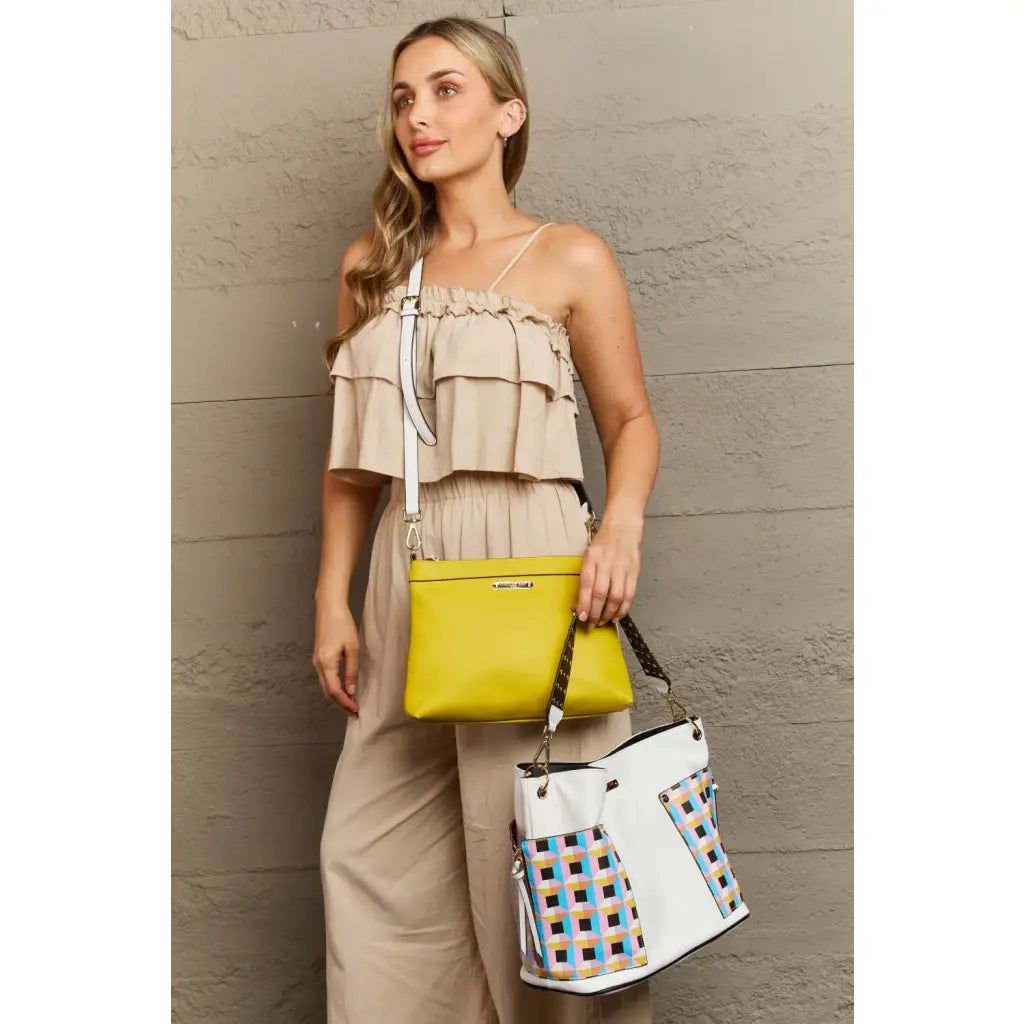 This fantastically fun handbag three piece set includes a Large Shoulder Bag Solid Crossbody and charming Heart Coin