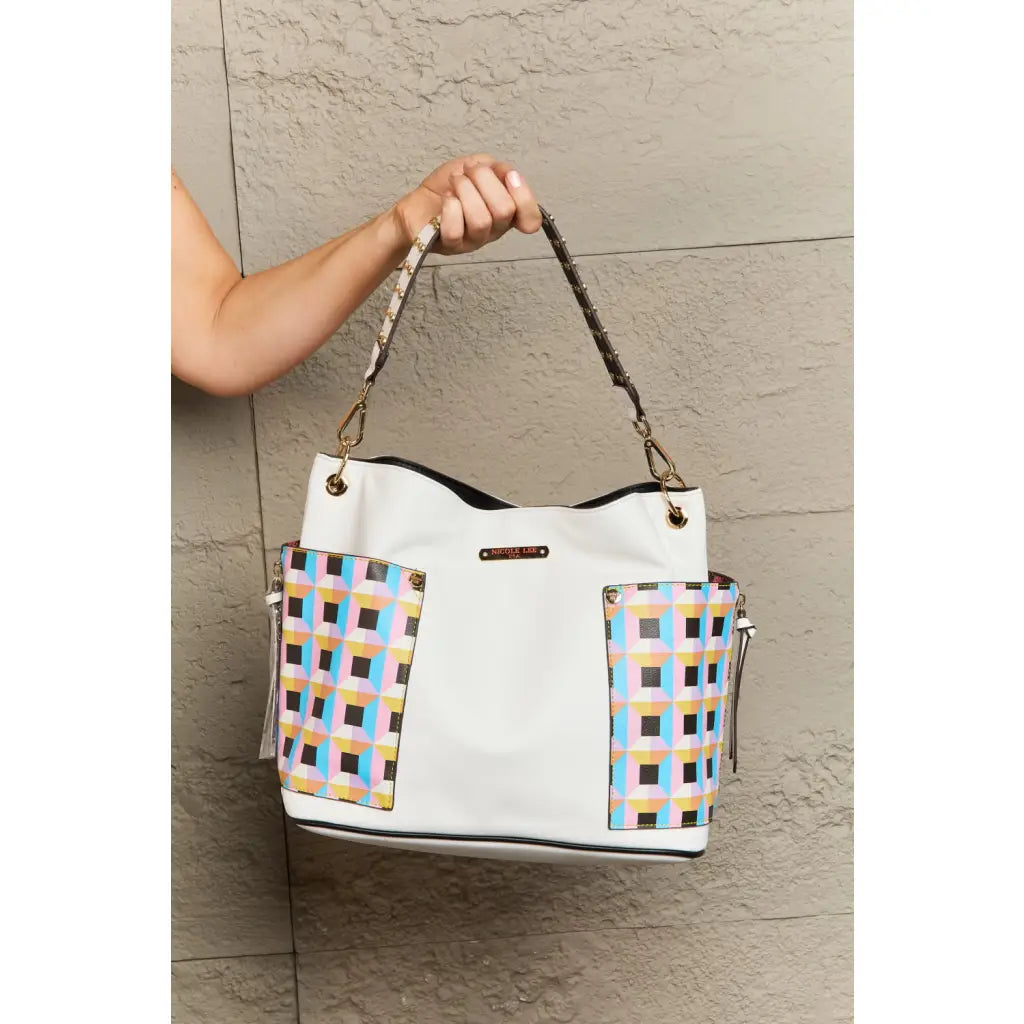 This fantastically fun handbag three piece set includes a Large Shoulder Bag Solid Crossbody and charming Heart Coin