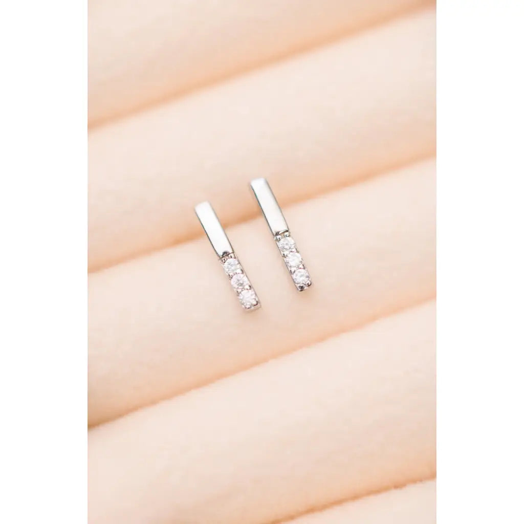 Our Tiny Sparkles Silver Bar Stud Earrings are made with 925 Sterling and Zircon stones for a touch of glamour.