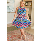 Our To the Levy Chevron Dress is perfect combination of style and versatility. With a rounded banded neckline necktie