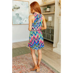 Our To the Levy Chevron Dress is perfect combination of style and versatility. With a rounded banded neckline necktie