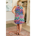 Our To the Levy Chevron Dress is perfect combination of style and versatility. With a rounded banded neckline necktie