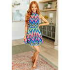 Our To the Levy Chevron Dress is perfect combination of style and versatility. With a rounded banded neckline necktie