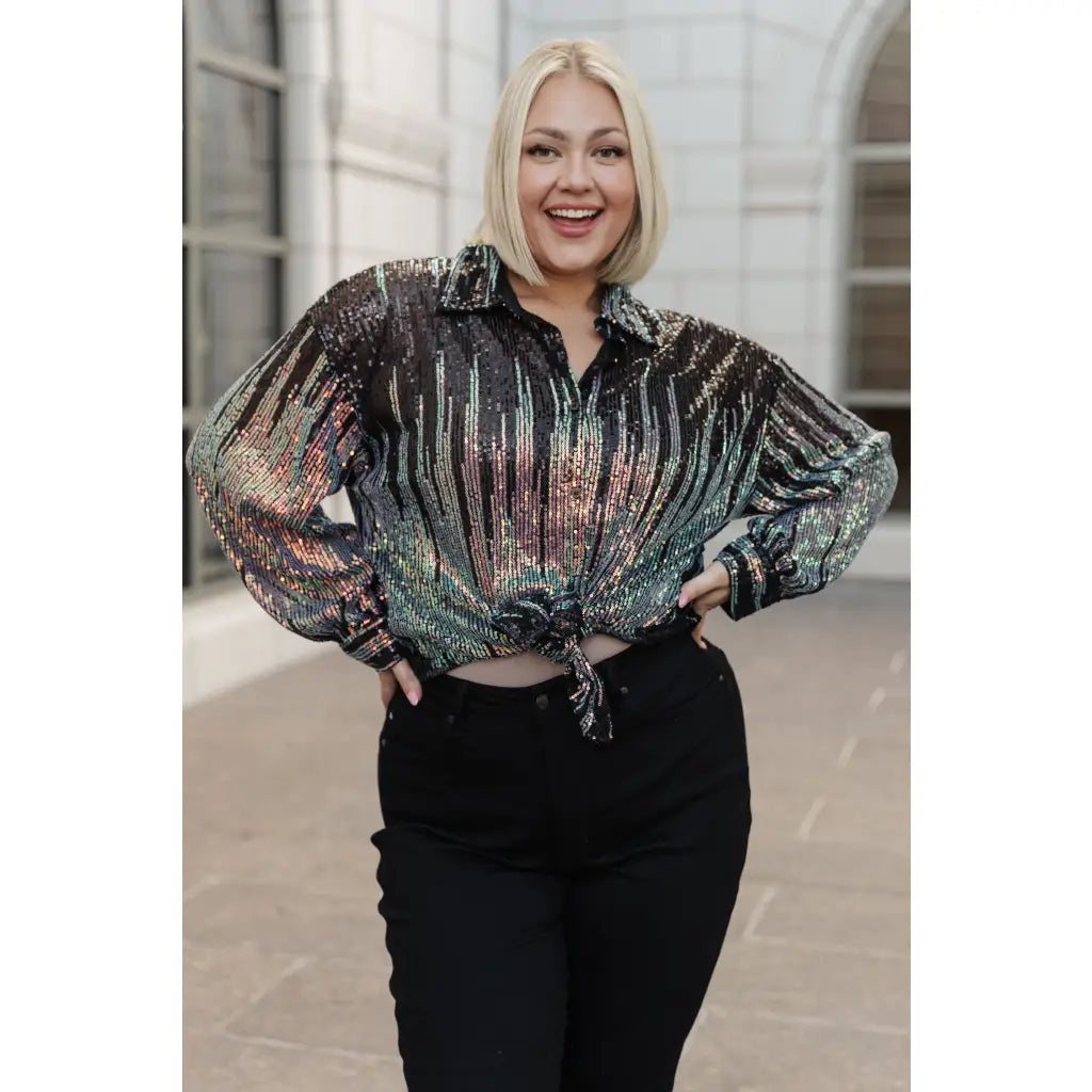 Be glamorous in this Too Glitz to Glam Button Up Shirt. Featuring a sheer sequin mesh two tone sequins collared