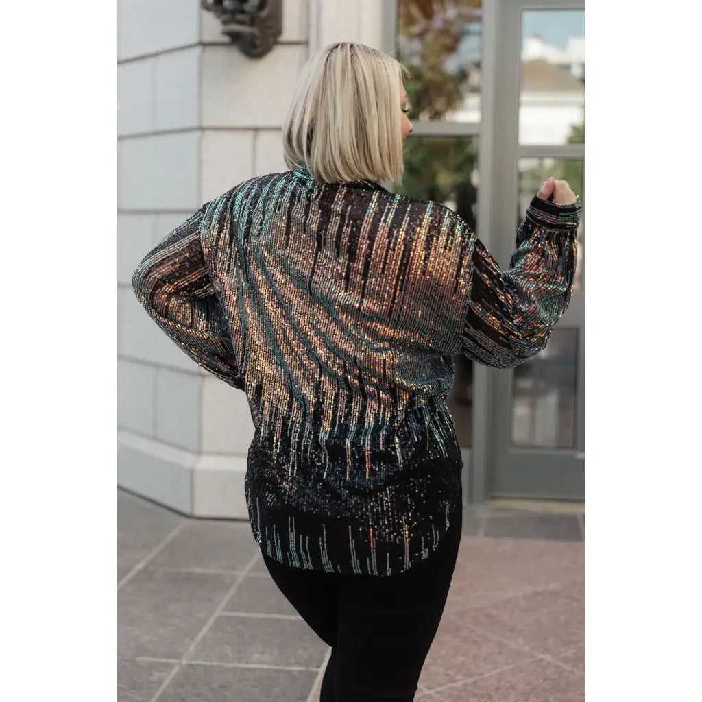 Be glamorous in this Too Glitz to Glam Button Up Shirt. Featuring a sheer sequin mesh two tone sequins collared