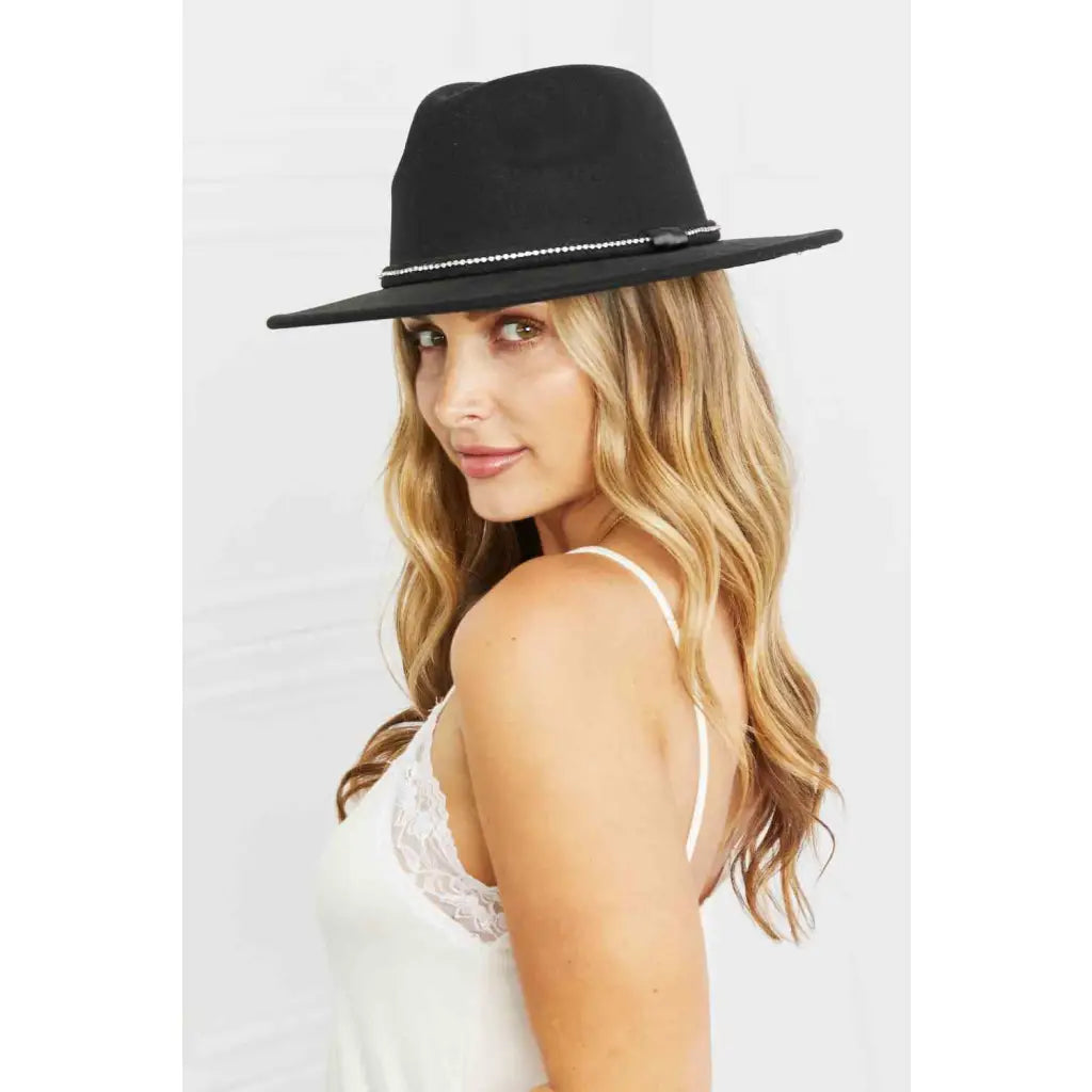 Our Touch of Bling Black Fedora Hat is the perfect accessory for any occasion that requires just a touch sparkle.
