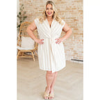 Look stunning in the Twisted and Tailored Vertical Striped Dress! Featuring a knotted front deep v-neck faux wrap. Plus