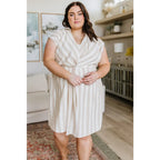 Look stunning in the Twisted and Tailored Vertical Striped Dress! Featuring a knotted front deep v-neck faux wrap. Plus