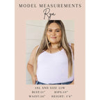 Make a statement in the Two Sides to Story Blouse! Half solid orange half paisley and floral mix print short sleeve top