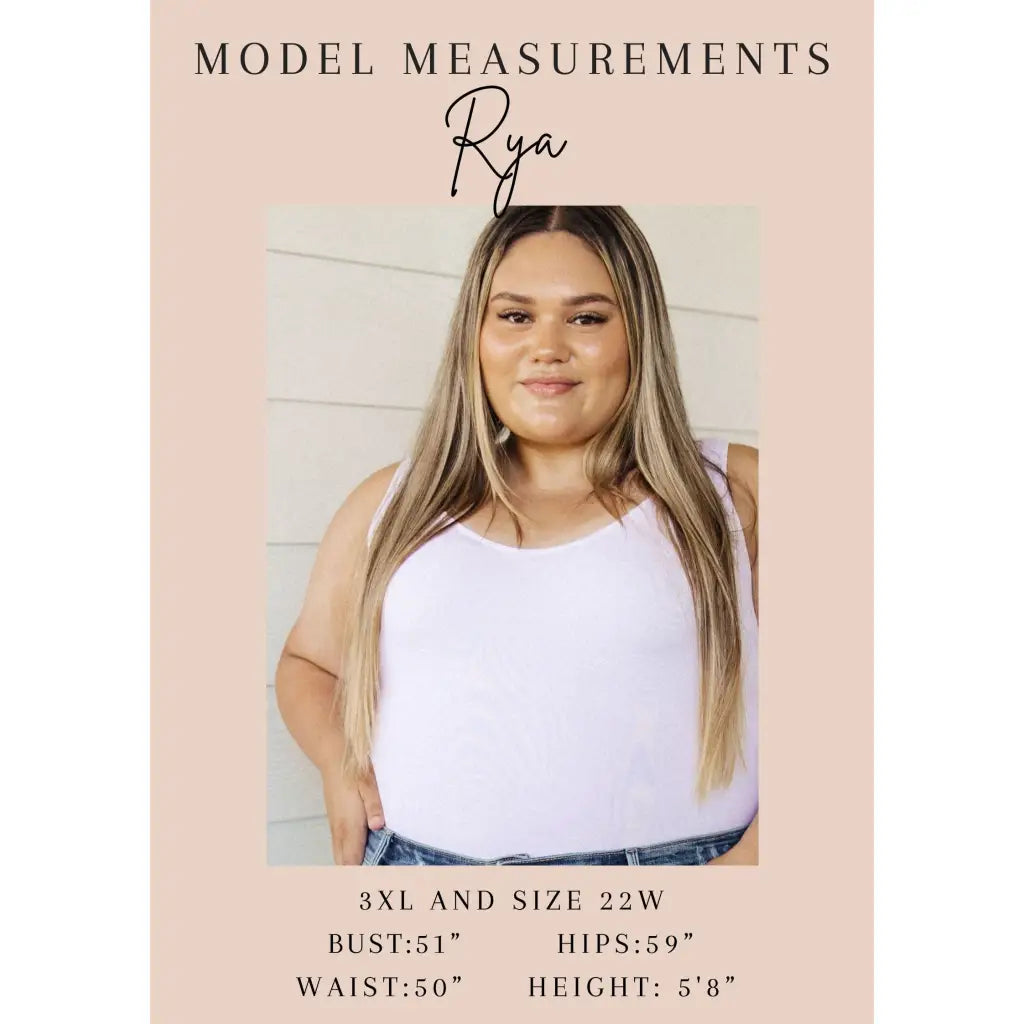 Make a statement in the Two Sides to Story Blouse! Half solid orange half paisley and floral mix print short sleeve top