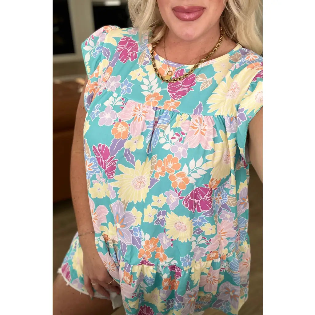 Discover the perfect blend of style and comfort with our Understanding Assignment Floral Babydoll Top in Teal!