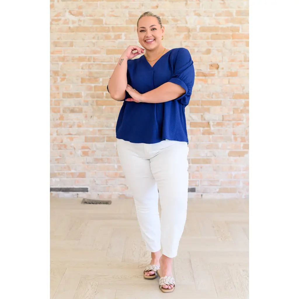 Our Up For Anything V Neck Blouse in Navy is a perfect staple piece for any closet! The crinkle woven fabric adds