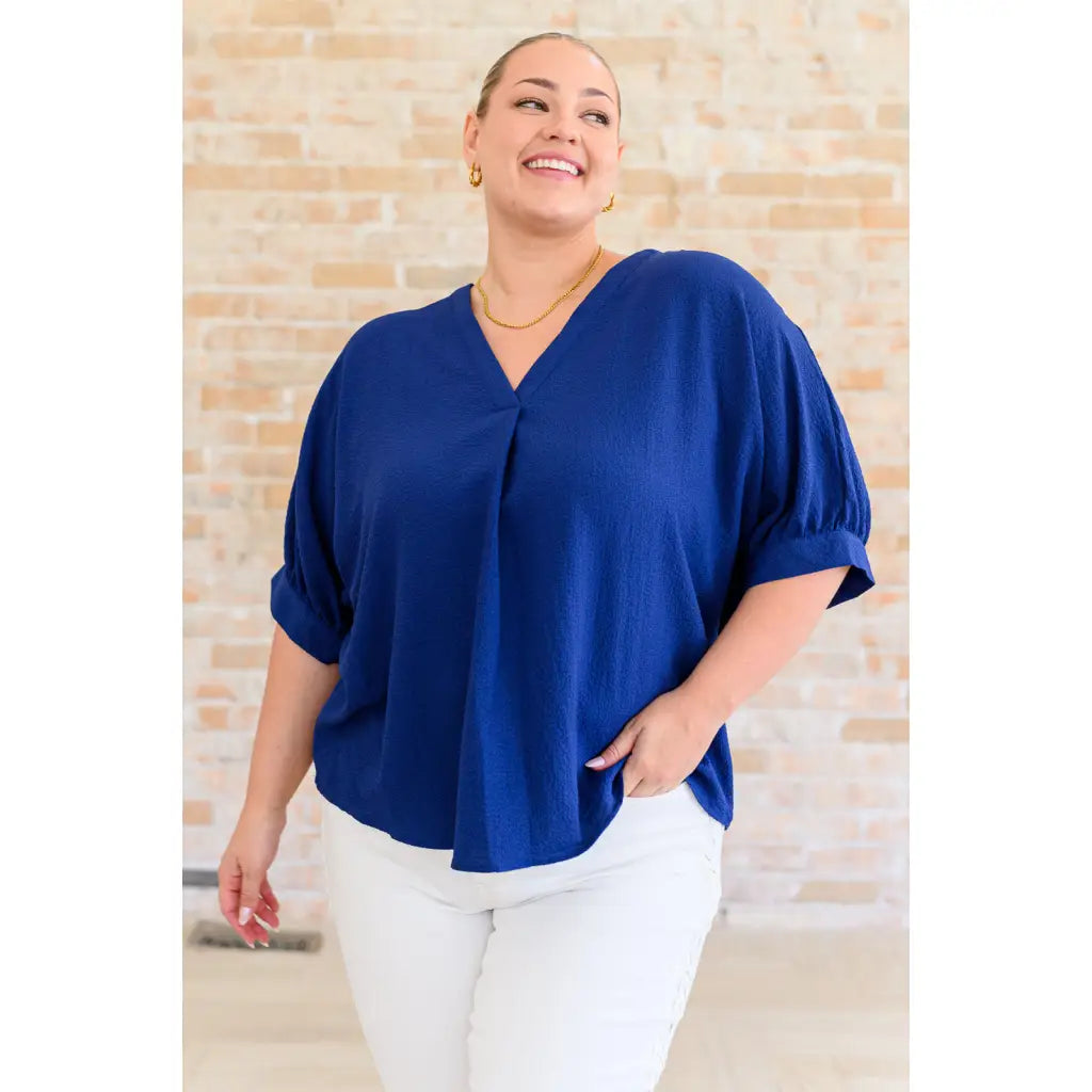 Our Up For Anything V Neck Blouse in Navy is a perfect staple piece for any closet! The crinkle woven fabric adds