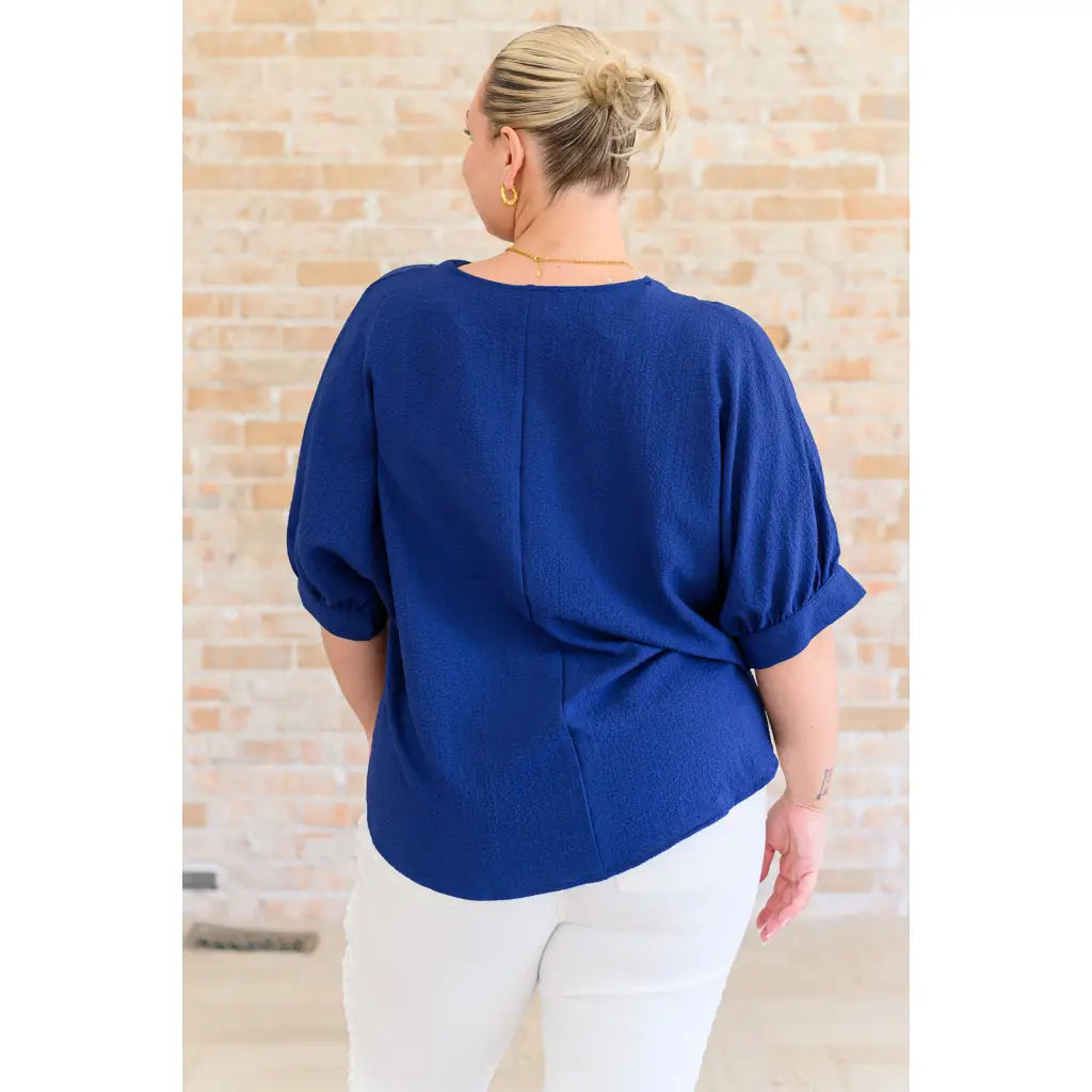 Our Up For Anything V Neck Blouse in Navy is a perfect staple piece for any closet! The crinkle woven fabric adds