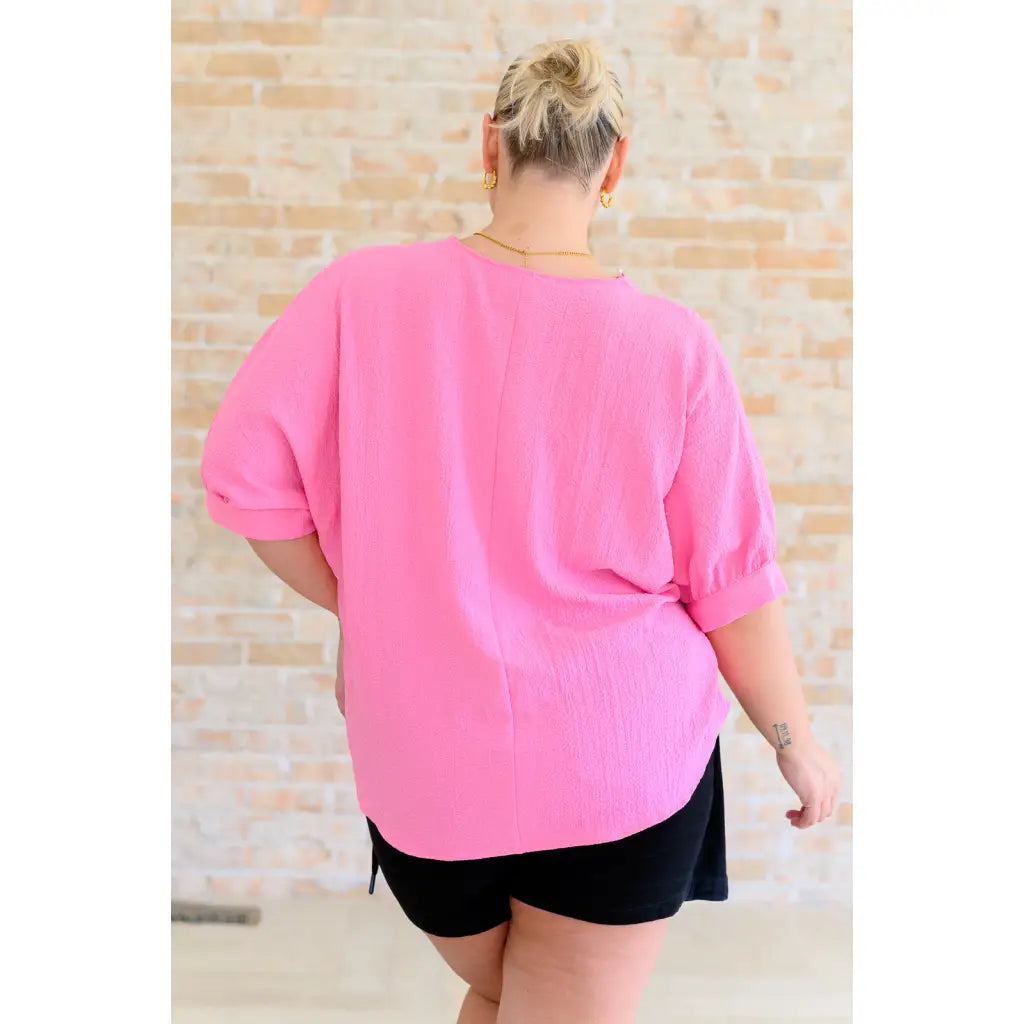 Our Up For Anything V Neck Blouse in Pink is a perfect staple piece for any closet! The crinkle woven fabric adds