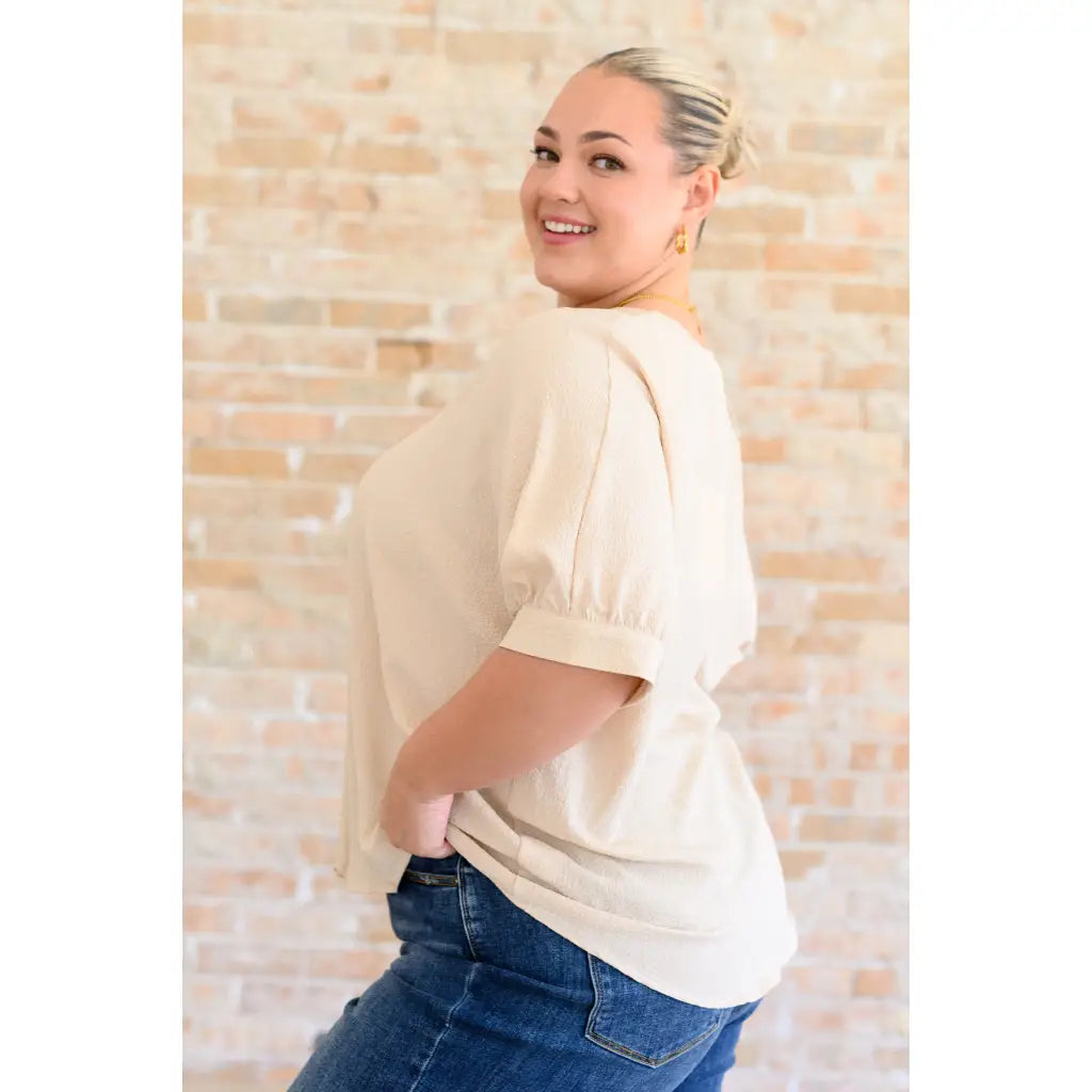 Our Up For Anything V-Neck Blouse in Taupe is a perfect staple piece for any closet! The crinkle woven fabric adds