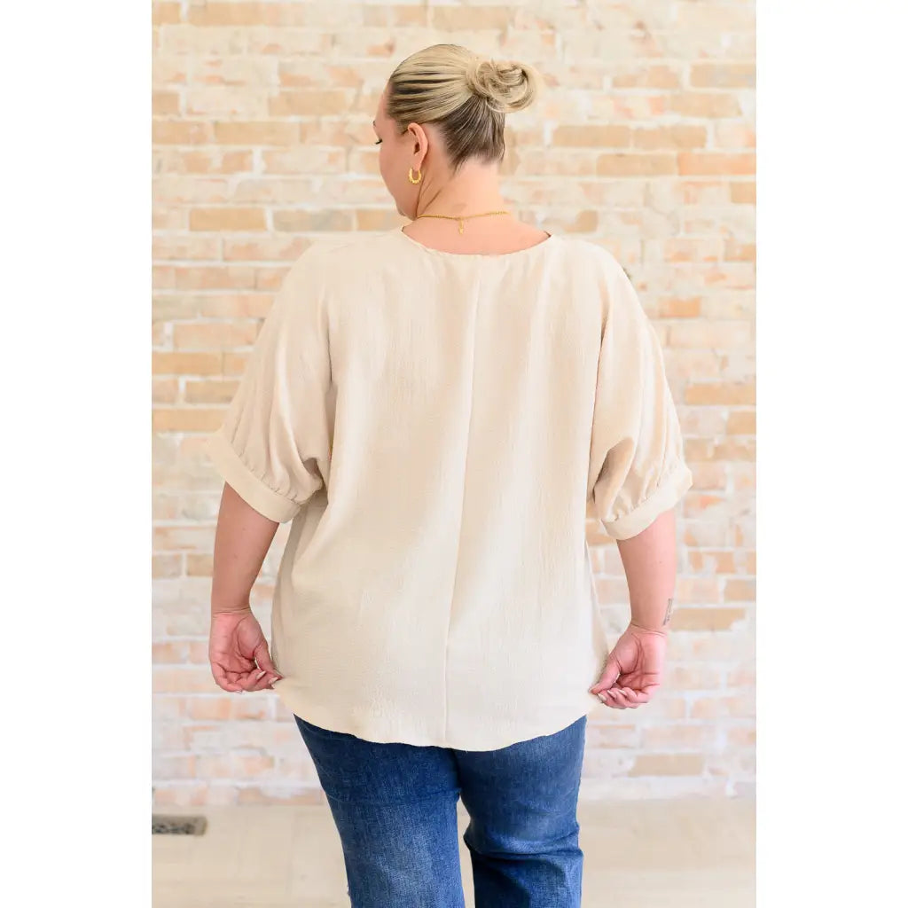 Our Up For Anything V-Neck Blouse in Taupe is a perfect staple piece for any closet! The crinkle woven fabric adds